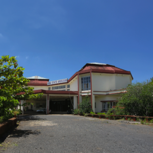 The Goa State Museum features a prominent large building topped with a striking red roof.