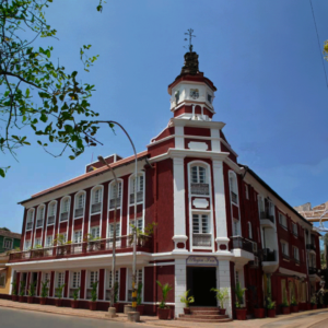 A grand structure with a clock tower, located in the picturesque area of Fontainhas, Goa