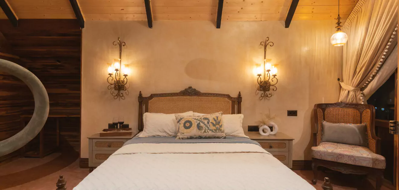 A bed with a wood headboard and a wood ceiling