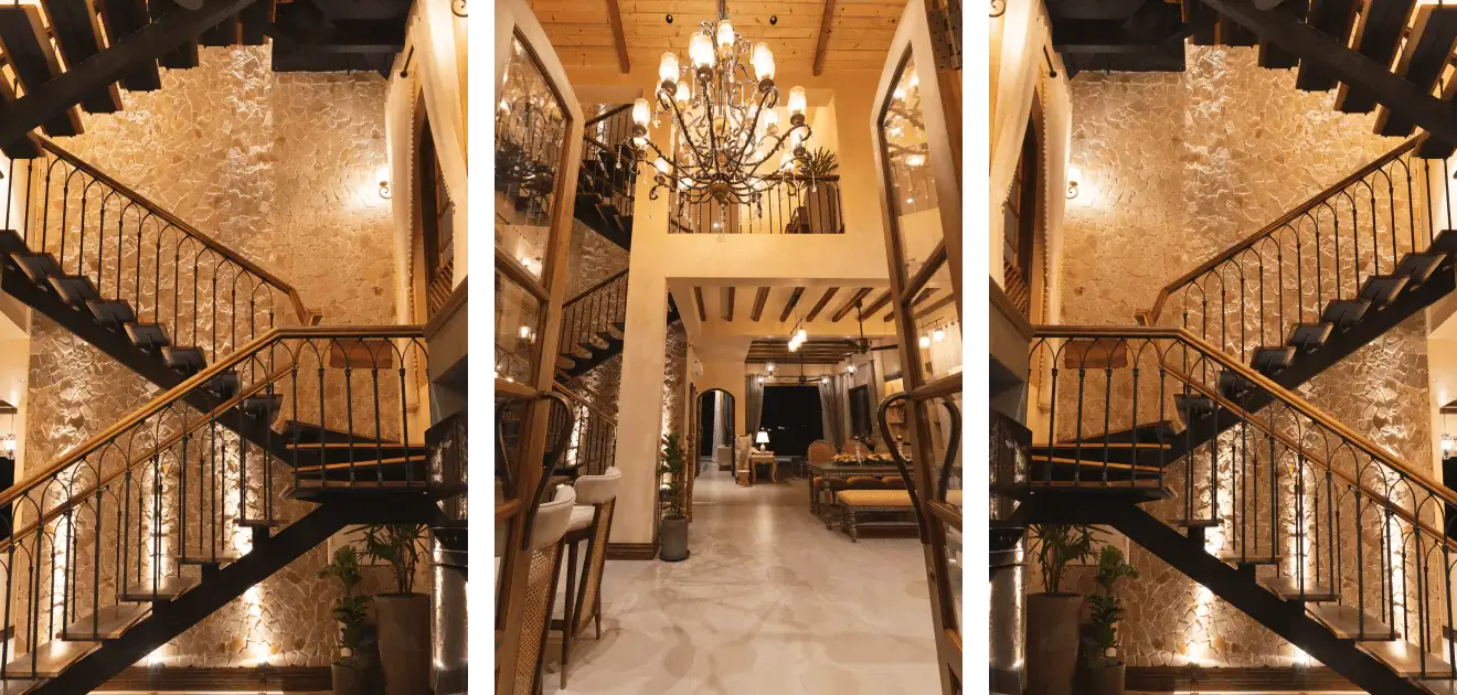 A luxurious room with a chandelier and stairs